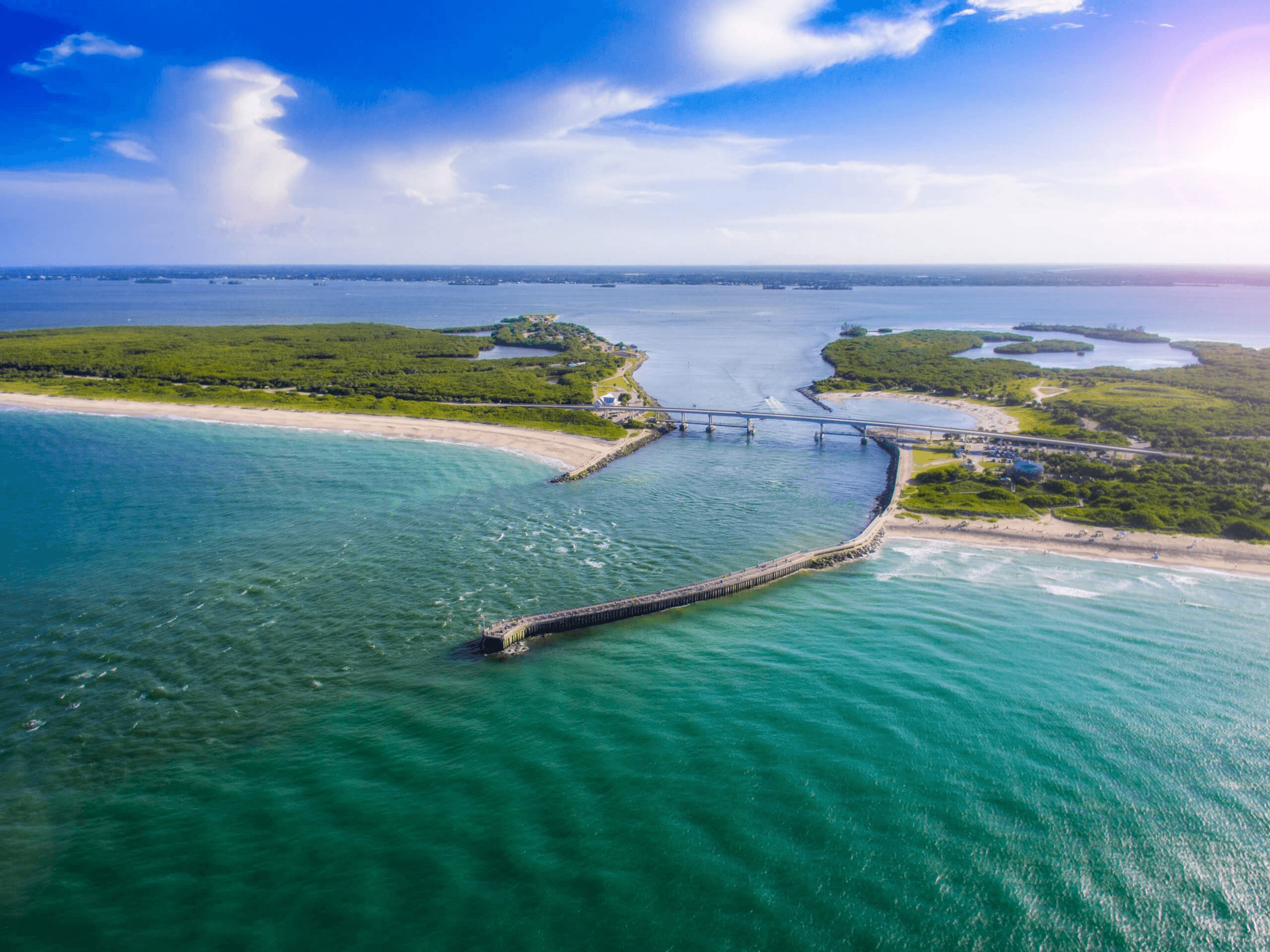 Aerial view of Sebastian Inlet with turquoise waters meeting the Atlantic Ocean